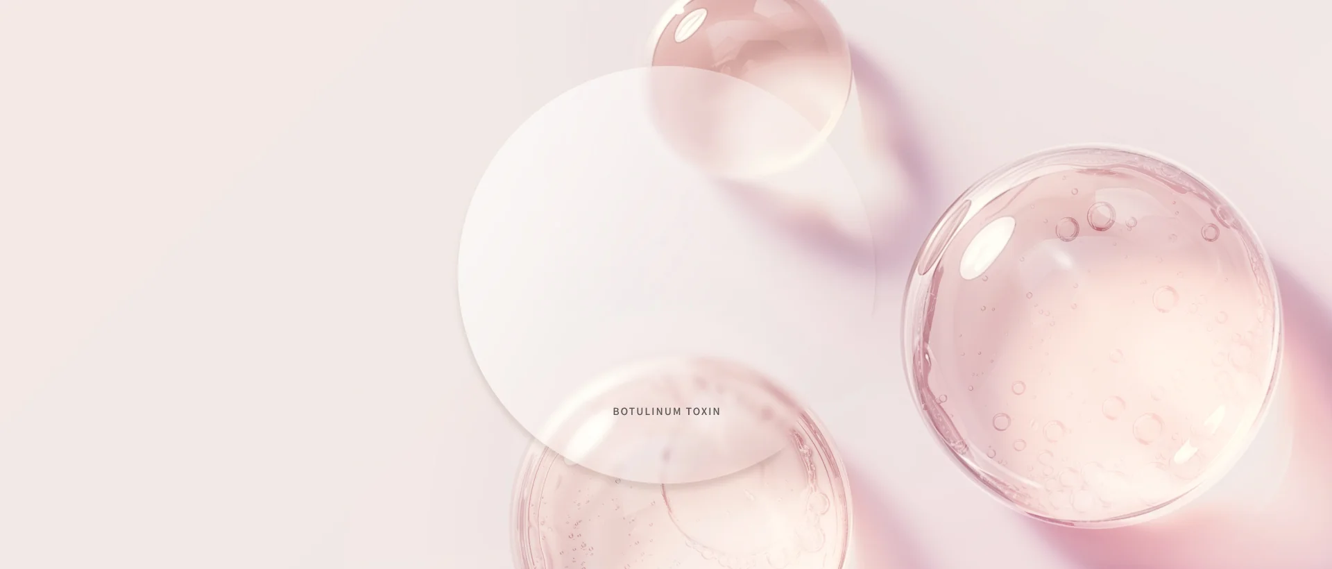 ピンク色の背景にボツリヌストキシンの透明な球体が浮かんでいる。